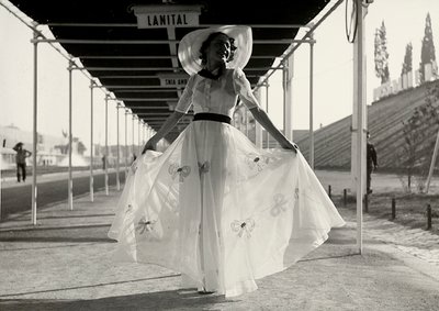 Model in a full summer dress created by the couture house Graldi by Luis Bogino