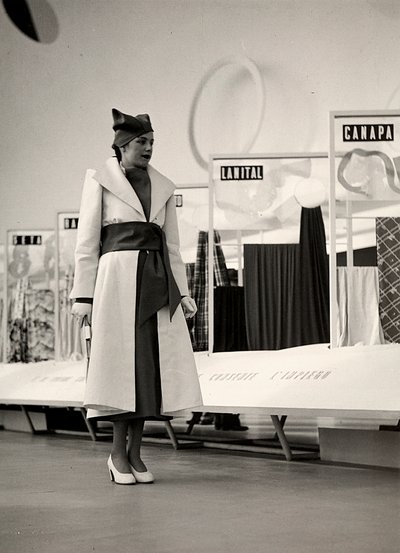 Model in an overcoat created by the couture house "Lamma" by Luis Bogino