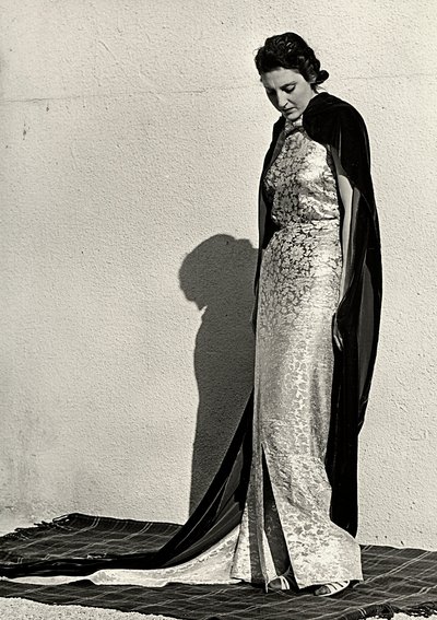 Model in evening dress created by the Italian couture house "Dragoni" by Luis Bogino