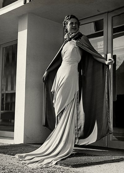 Model in evening dress created by the couture house Graldi by Luis Bogino