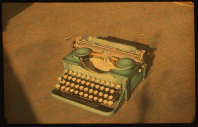 Still life color photograph of a typewriter taken with Autochrome Lumière and a 35mm camera by Luis Marden
