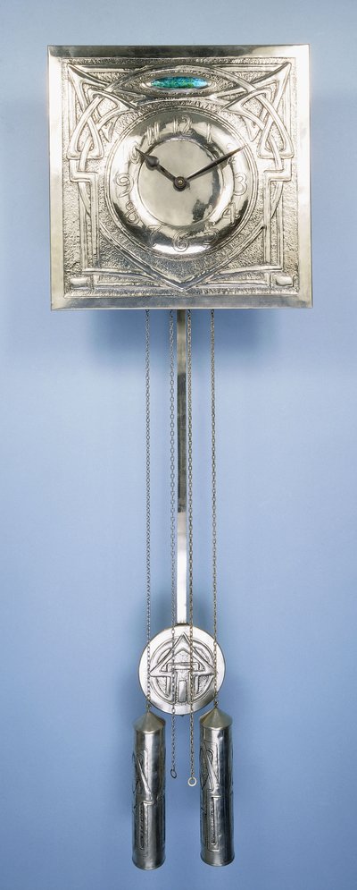 A wall clock by Margaret Gilmour, decorated in repousse with Celtic entrelac designs by Margaret Gilmour