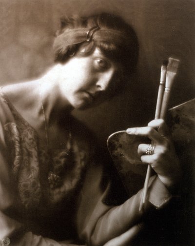 Half-length portrait of the painter Elisabeth Chaplin. She is holding two brushes and a palette in her left hand by Mario Nunes Vais