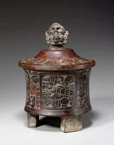 A Mayan lidded and carved tripod vessel, c.250-450 by Mayan Mayan