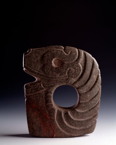 Zoomorphic axe in carved stone representing a stylized snake by Mayan Mayan