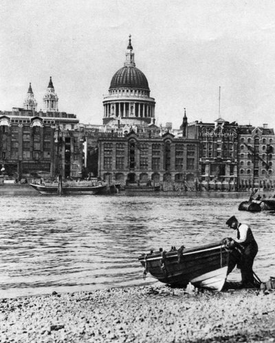 Thames waterman and his boat on the beach at Bankside, London, 1926-1927 by McLeish
