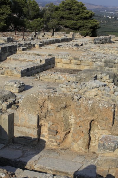 Minoan archaeological site of Phaistos. View over the North East Complex. Complex of four rooms directly adjoining the old palace. These rooms were used to store valuable ritual vessels. The famous Phaistos disc bearing hieroglyphic writing was found here. by Minoan