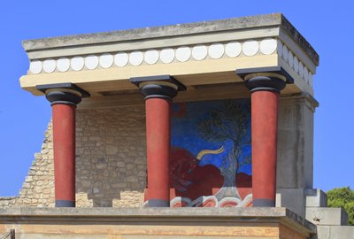 Minoan archaeological site of Knossos. North entrance, North pillar Hall. Bastion reconstructed by Arthur Evans with a copy of a restored relief fresco of a bull. Knossos, Crete by Minoan