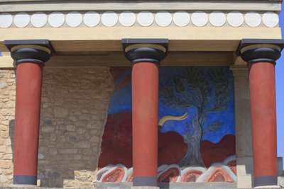 Minoan archaeological site of Knossos. North entrance, North pillar Hall. Bastion reconstructed by Arthur Evans with a copy of a restored relief fresco of a bull. Knossos, Crete by Minoan