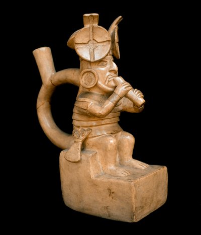 Precolombian art, mochic civilization: anthropomorphic terracotta vase representing a character playing the Quena, flute of the Andes by Moche Moche