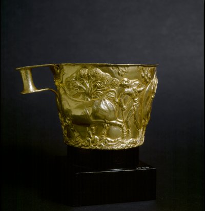 Gold cup decorates a scene of capture of a bull by Mycenaean