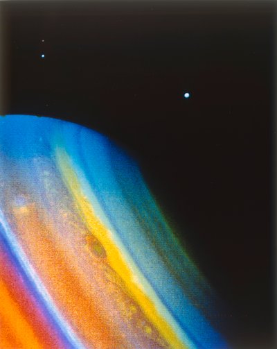 Saturn and its moon Dione, seen from the Voyager 2 spacecraft by NASA Images