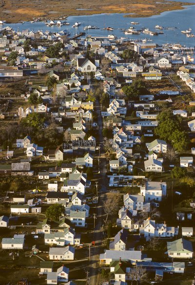 Aerial photograph of houses along King Street, the settlement spine of Tangier Island by Nathan Benn