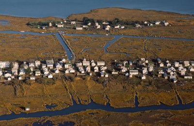 Aerial photograph of houses along King Street, the settlement spine of Tangier Island by Nathan Benn