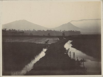 Man Working on the Land at the Foot of a Smoking Volcano by Onnes Kurkdjian