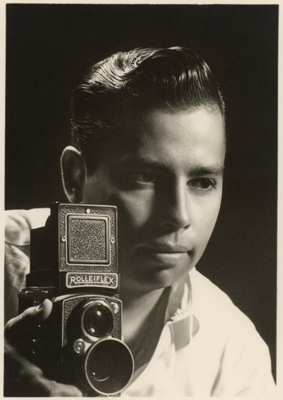 Orlando Suero portrait with Rolleiflex camera by Orlando Suero
