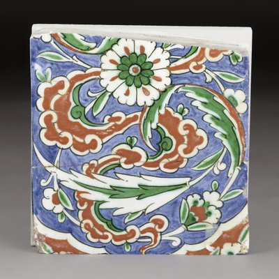 A partial Iznik pottery tile, Ottoman Turkey by Ottoman School