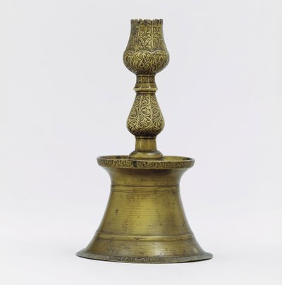 An Ottoman brass candlestick, the neck with incised arabesque decoration rising into the shape of a tulip by Ottoman School