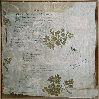 Piece of tablecloth on which Verlaine has written his poems 