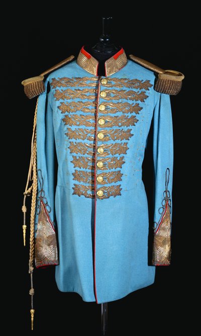 A Persian court uniform of powder blue woolcloth embroidered in gilt thread, gilt bullion epaulettes, lined in scarlet satin by Persian School