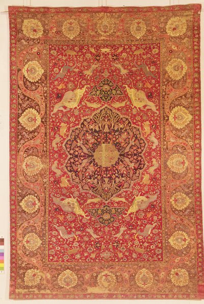 Rug decorated with scenes of fighting animals by Persian School