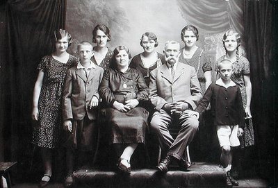 Family with numerous children, early twentieth century by Photographer Austrian