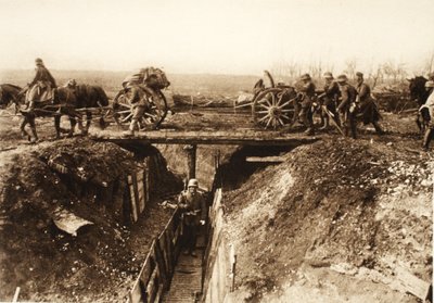 Field Artillery Cross Over a Stormed Enemy Trench; Fascine Bundles Fastened to the Gun Carriage for Use in Overcoming Enemy Positions (b/w photo) by Photographer German