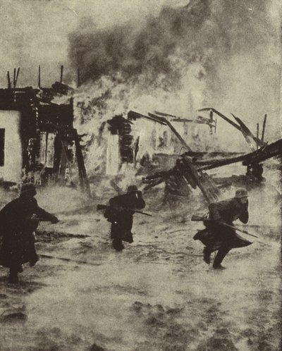 German soldiers advancing through the burning ruins of Rotterdam after its bombing by the Luftwaffe, World War II, May 1940 by Photographer German