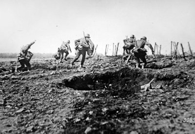 WWI German stormtroopers advance at Sedan with bags of grenades slung round their necks, Western Front by Photographer German