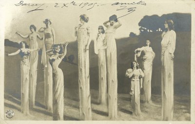 Women on stilts dressed as asparagus by Photographer German