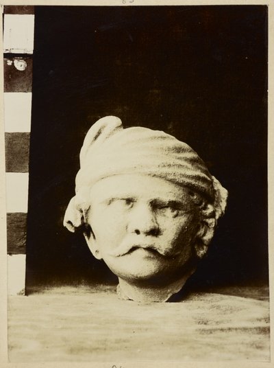 Taxila, Chir Tope [Dharmarajika Stupa]. Stucco Head by Photographer Indian
