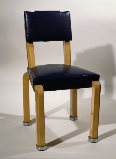 Chair, by Pierre-Emile Legrain, in blue leather and sycamore wood, Art deco style. France, 20th century. by Pierre E. Legrain