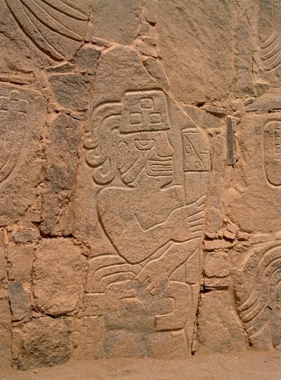 Figure of a warrior wearing a helmet and holding a club by Pre Columbian Pre Columbian