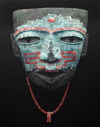 Funeral mask covered by turquoise and red shell mosaic. Artifact from Teotihuacan, Mexico City. Teotihuacan Civilization - Precolombian art: funeral mask of turquoise and pink stones dating from the civilization of Teotihuacan III (300-650 AD) by Pre Columbian Pre Columbian