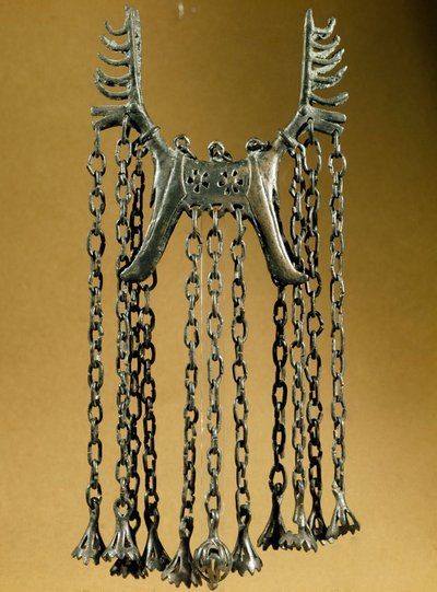 Elk shaped pendant with two heads from a site in Dolanlar. Bronze Age. Azerbaijan State Religion History Museum, Baku by Prehistoric Prehistoric
