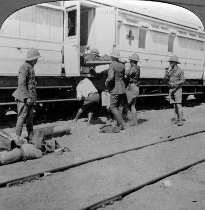 Lifting wounded soldiers onto a hospital train, East Africa, World War I by Realistic Travels Publishers