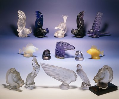 Various glass car mascots (of birds, fish, horses and a human head) by Rene Jules Lalique