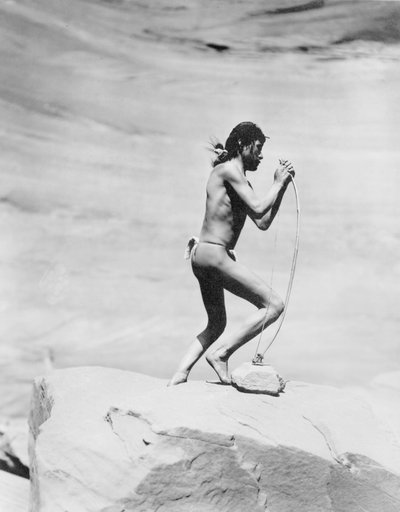 Navajo Indian Stringing the Bow by Roland W. Reed