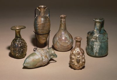 A group of delicate Roman blown and mould blown glass cosmetics flasks, 1st century AD by Roman