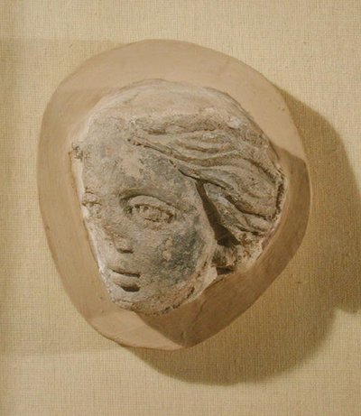 Relief depicting the head of a woman, from Tunisia by Roman