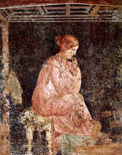 Young woman sitting by Roman