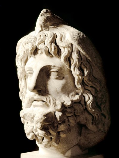 Roman art: bearded head covered by a dead bird of Sarapis or Serapis, Greek-Egyptian god of Death. Marble sculpture from Carthage. Paris, Musee du Louvre by Roman
