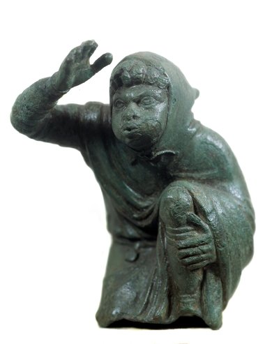 Roman Art: Bronze Statuette of Black Slave Kneeling and Blowing by Roman