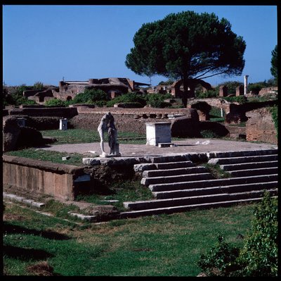 Roman art: view of the ruins of the temple of Hercules and statue of Gaius Cartilius Popplicola, citizen of Ostia by Roman