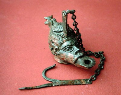 Hanging oil lamp in the shape of an African