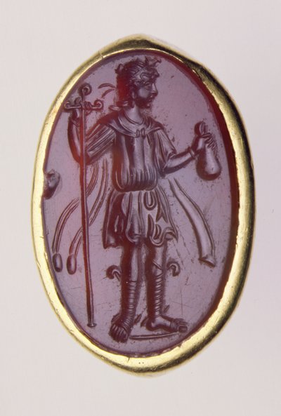 Intaglio set in a gold ring depicting young male figure by Roman Roman