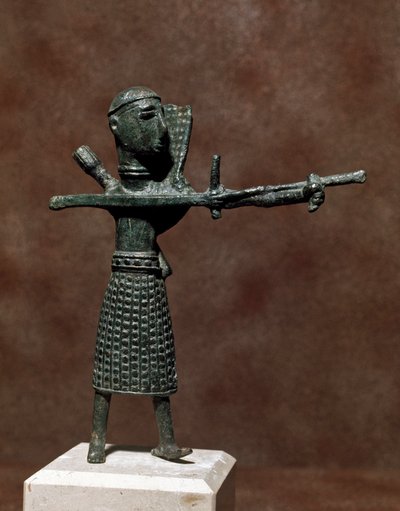 Statuette of warrior wearing an oriental bronze skirt. 8th-7th century BC. Museo Nazionale Archeologico, Cagliari, Sardinia, Italy by Sardinia Nuragic Civilization