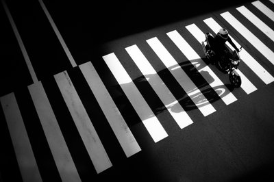 Motorcycle on Zebra Crossing by Satoshi Hata