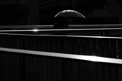 Solitary Umbrella Walk by Satoshi Hata