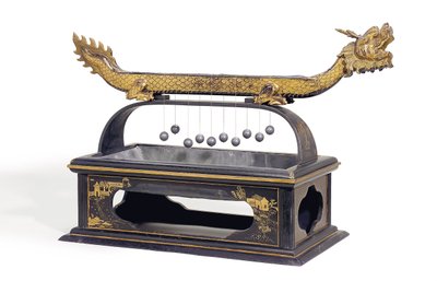 A Chinese black and gilt lacquered dragon fire clock by School Chinese